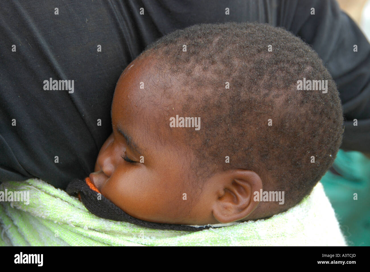 Baby sleeping on back african hi-res stock photography and images - Alamy