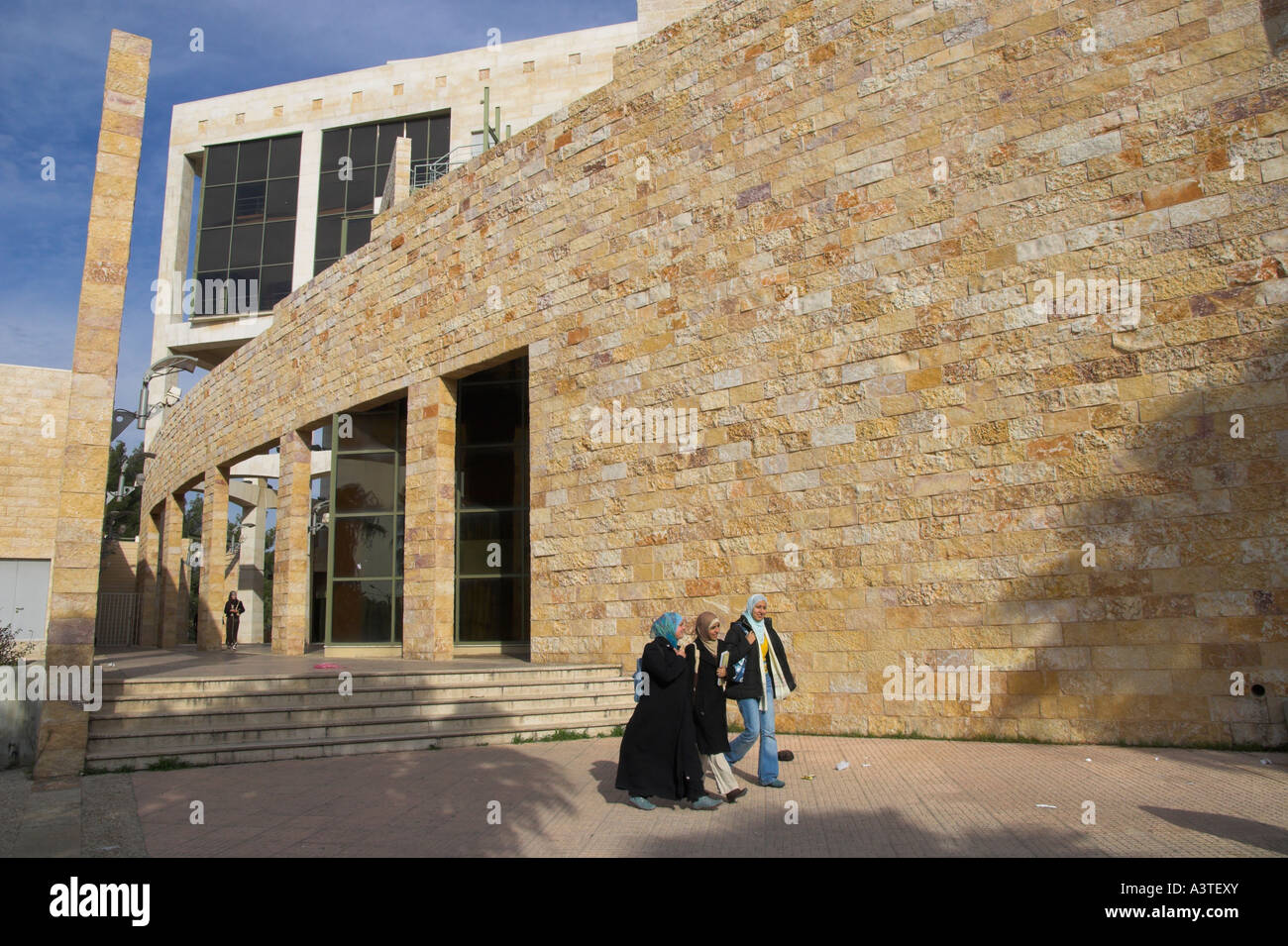 Jordan Irbid Yarmouk University ambiance view with female students wearing the veil walking past the building Stock Photo - Alamy