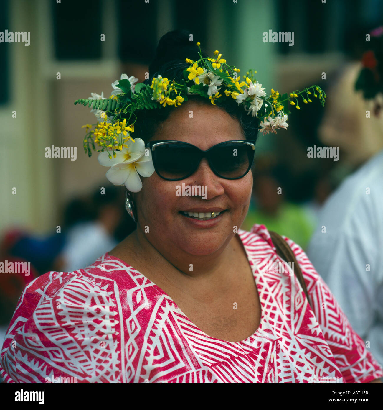 Close up of middle aged local lady wearing frangipani on one ear and pretty flower headdress on Upolu Island Western Samoa Stock Photo