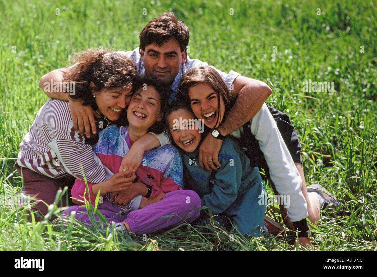 Group hug hispanic family hi-res stock photography and images - Alamy
