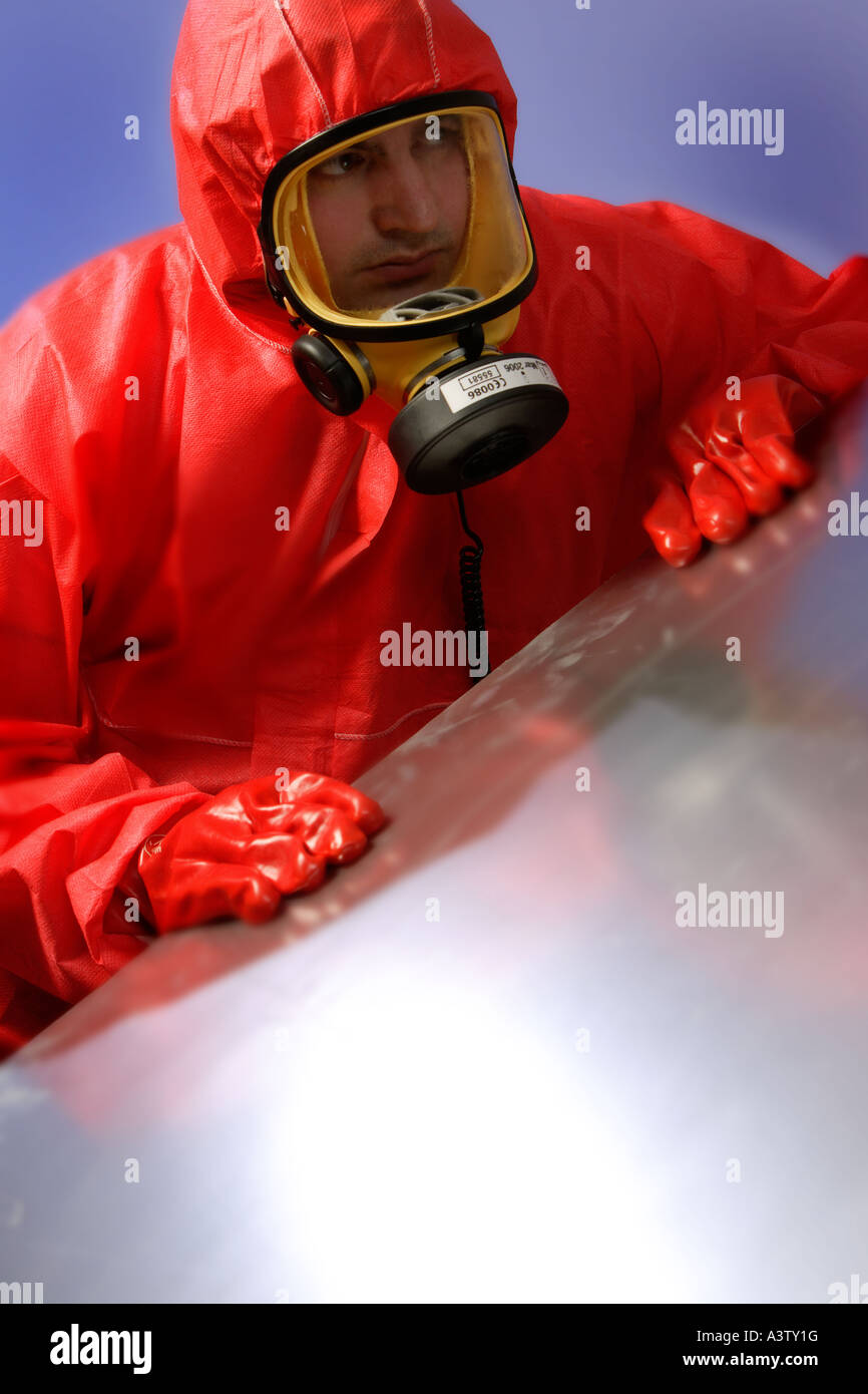 Asbestos Removal with red protective clothing and ventilator face mask