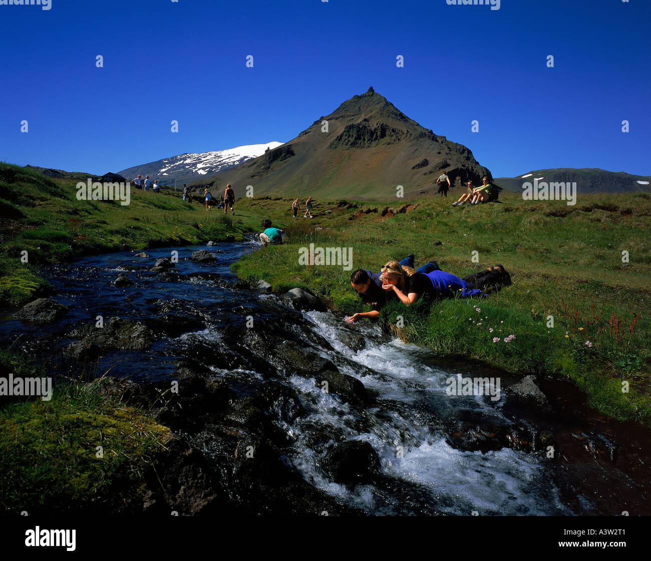 Couple enjoying fresh water Snaefellsnes Peninsula, Iceland Stock Photo