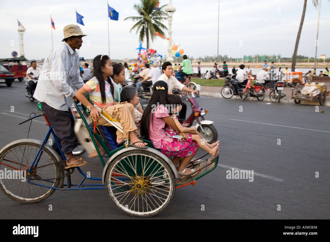 Family on Cyclo, Phnom Penh, Cambodia Stock Photo