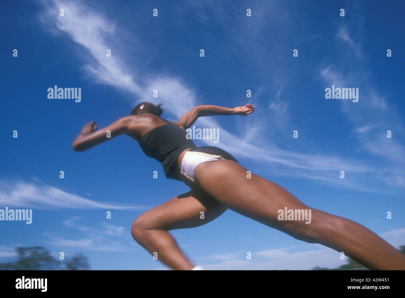 African American female track athlete running outside Stock Photo Alamy