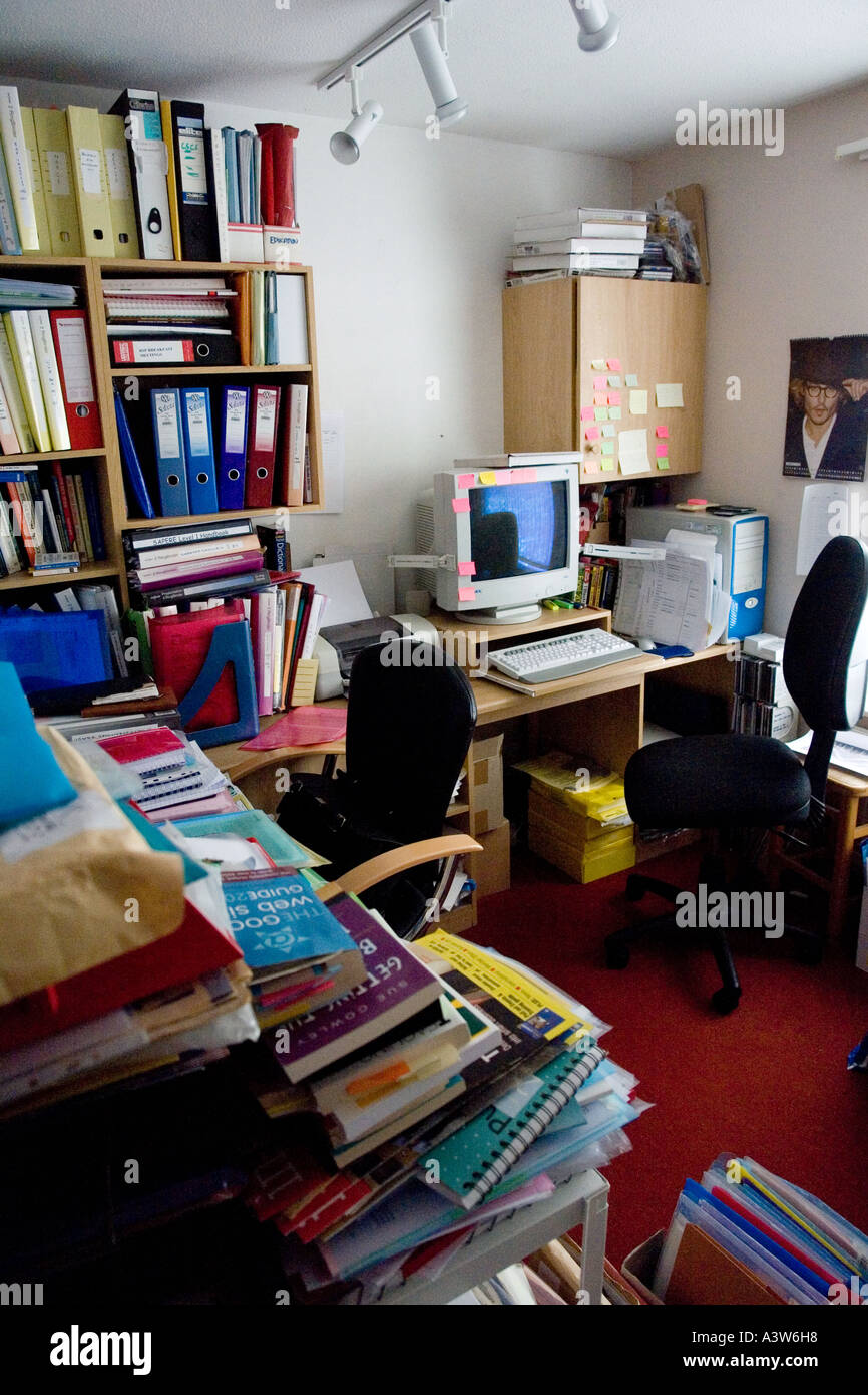 untidy home office clutter cluttered books files papers computer ...