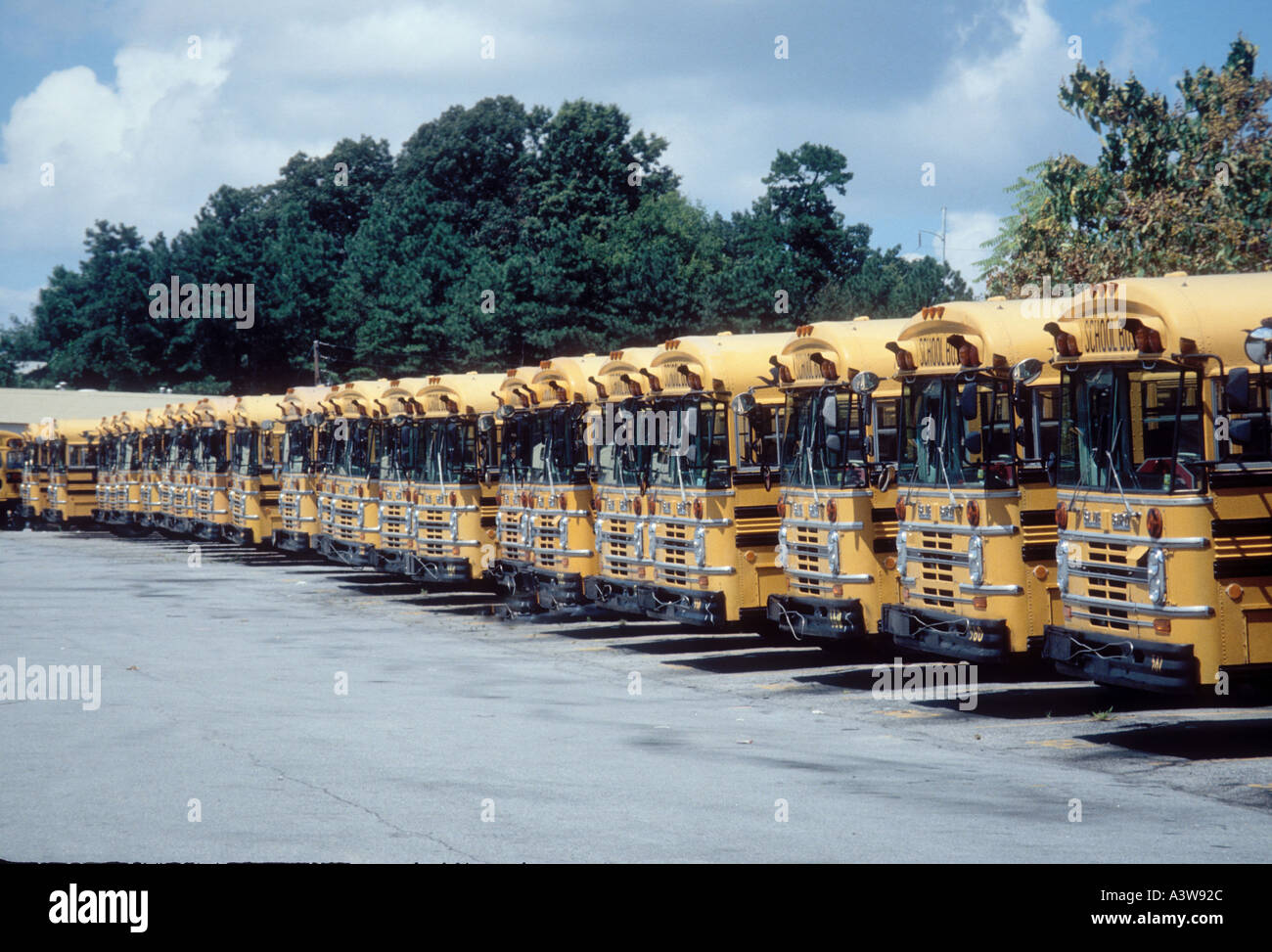Line of school buses in Atlanta GA Georgia for students Stock Photo