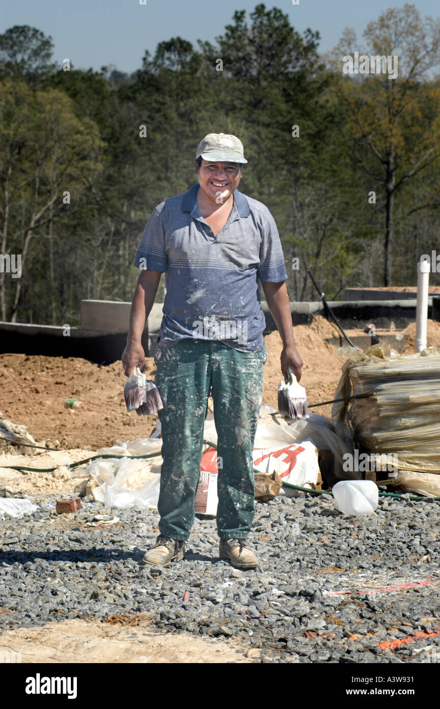 Hispanic Latin painter in construction site in Atlanta cleaning tools Stock Photo Alamy