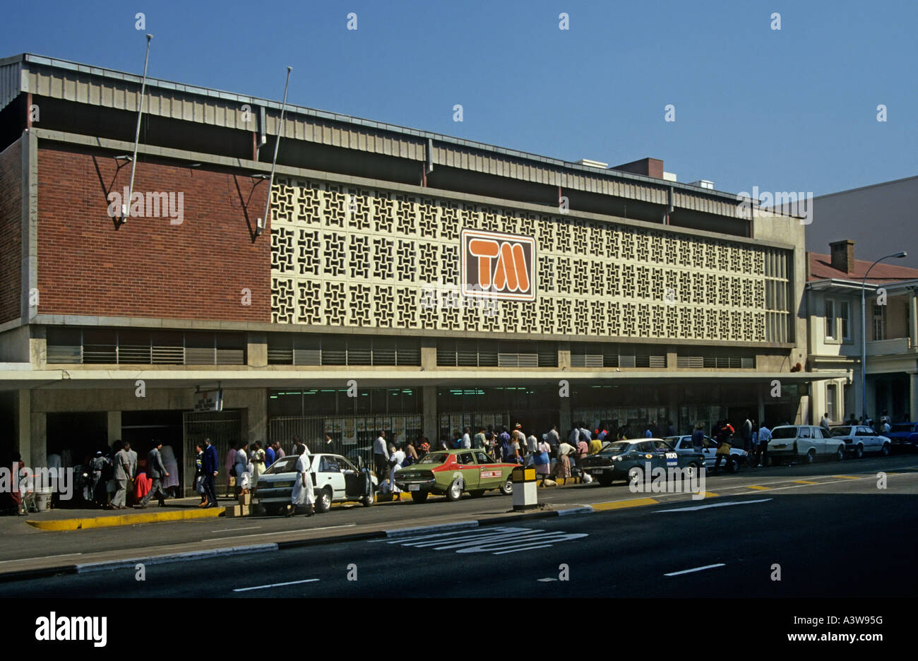 Taxis waiting to pick up locals shopping at supermarket Harare Zimbabwe Stock Photo