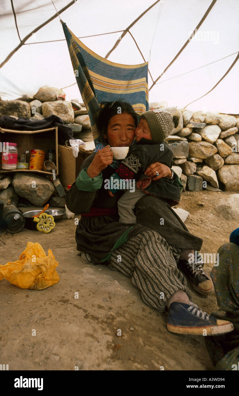 Ladakhi woman and son in parachute tea tent Markha Valley near Leh Ladakh Jammu and Kashmir northern India Stock Photo