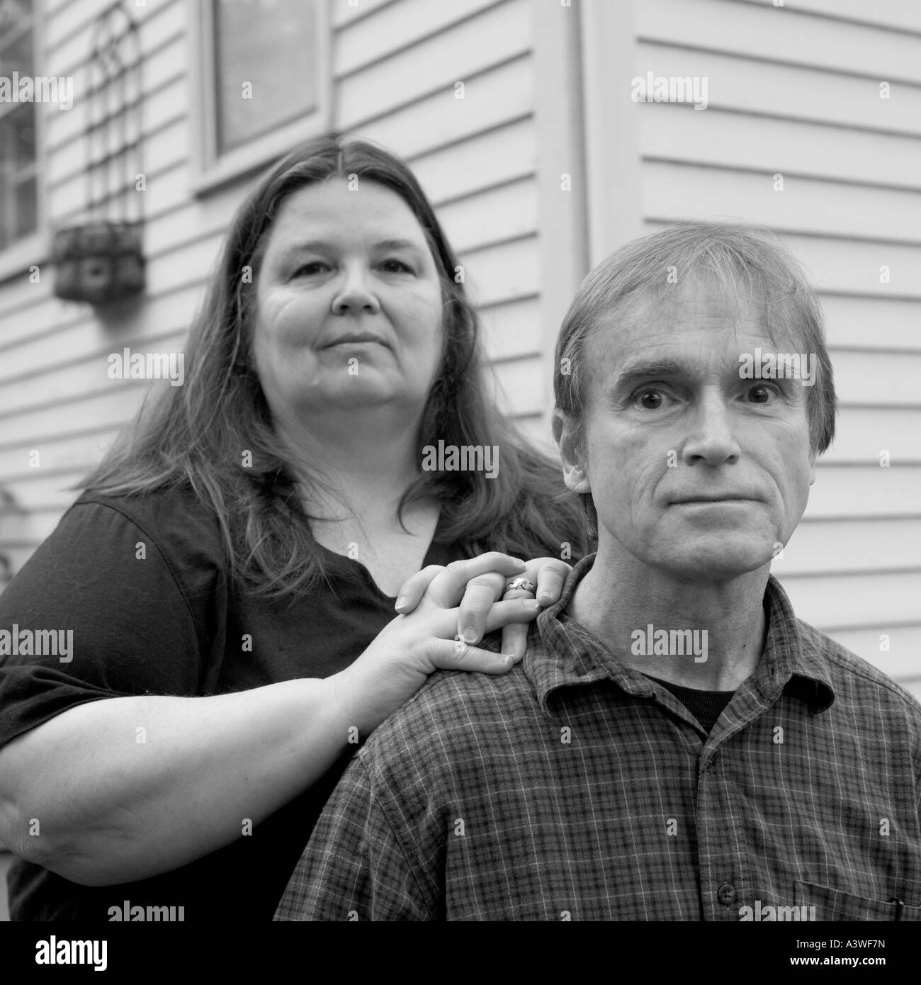 Husband and wife small business owners who cannot afford health insurance in CT USA Stock Photo