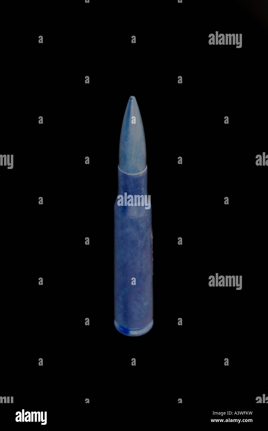 Symbolic Image of a Bullet on black Stock Photo