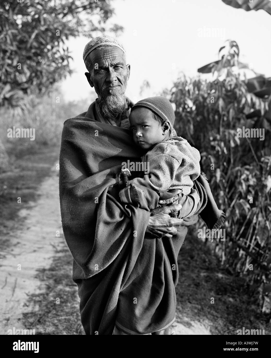 Grandfather and grandson, Bogra District, Bangladesh Stock Photo