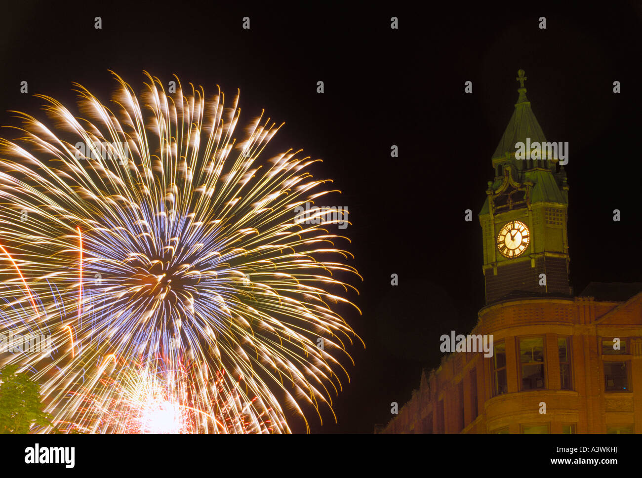Fourth of July fireworks burst behind the historic Savings Bank buiding