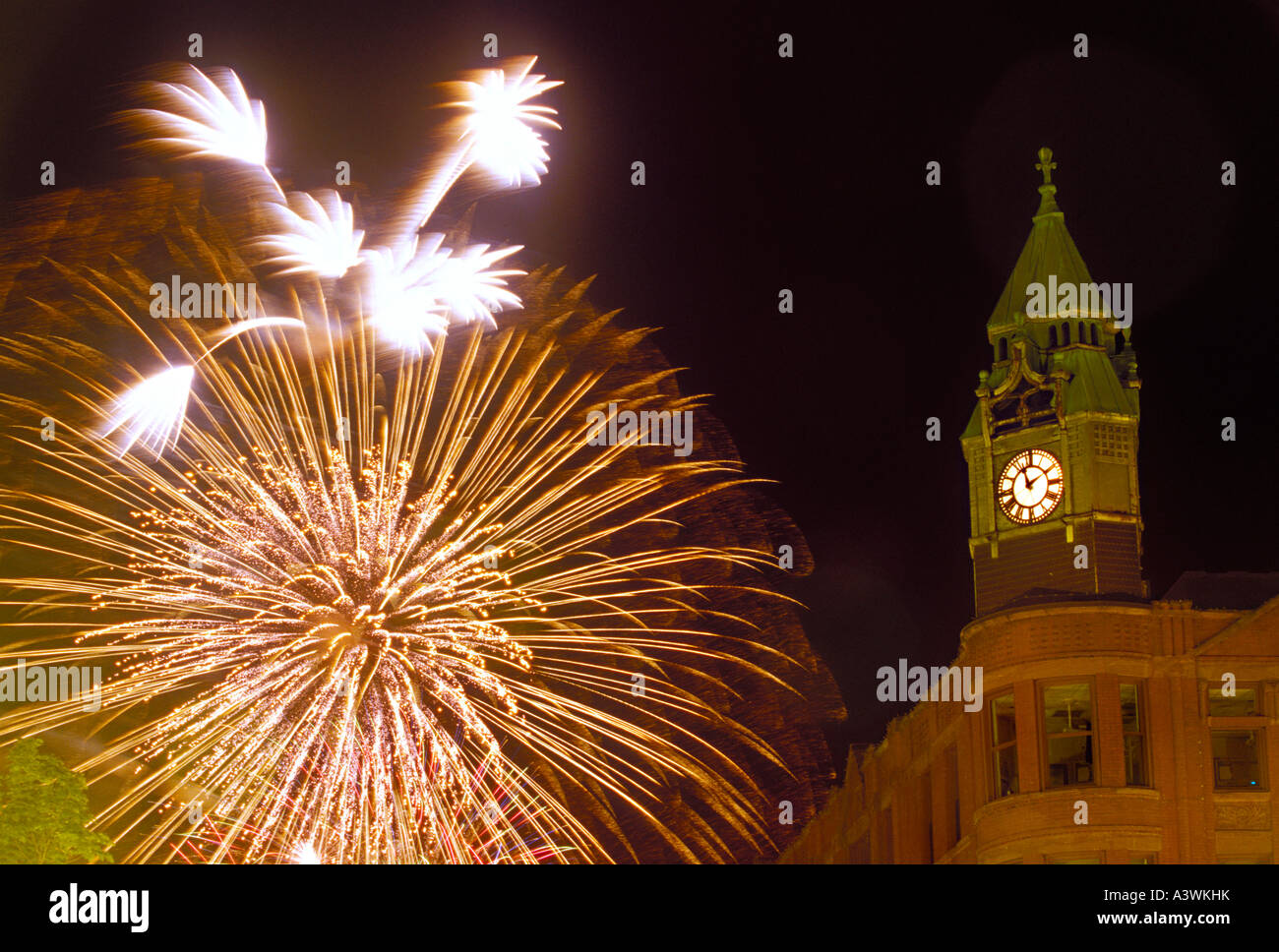 Fourth of July fireworks burst behind the historic Savings Bank