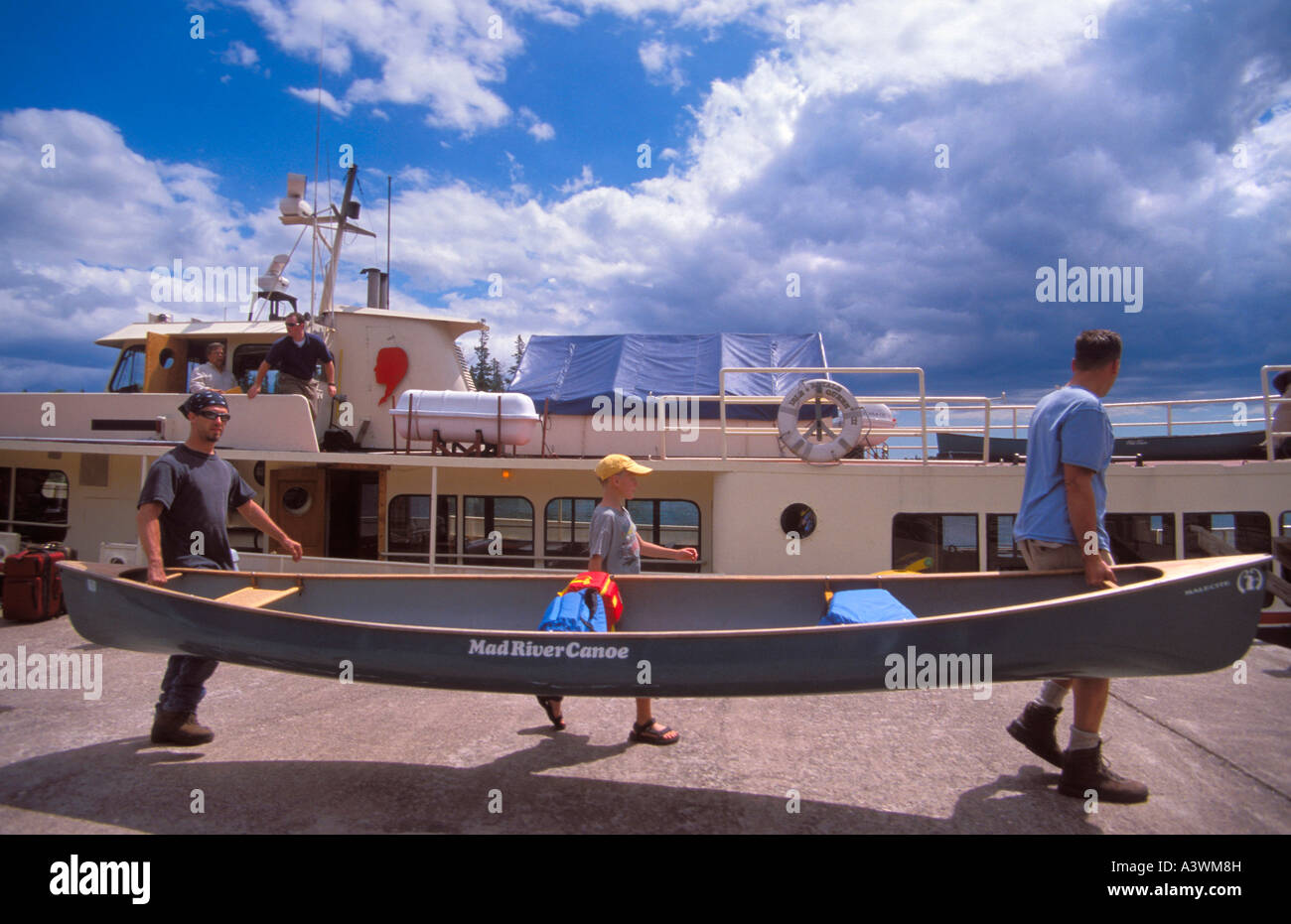 Loading canoe on ferry at Isle Royale National Park, Michigan Stock