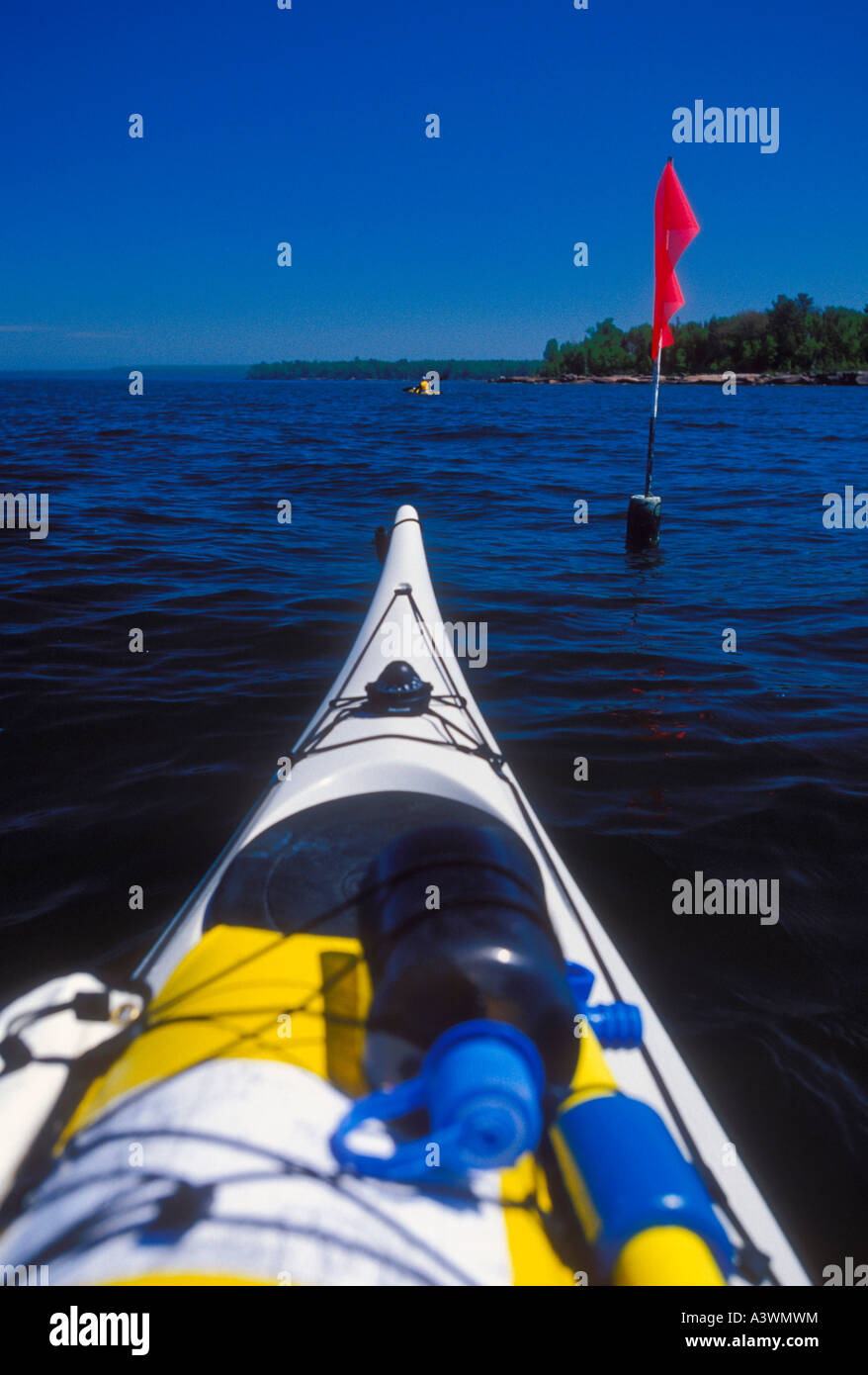 Sea kayaks and a commercial fishing net marker near York Island in