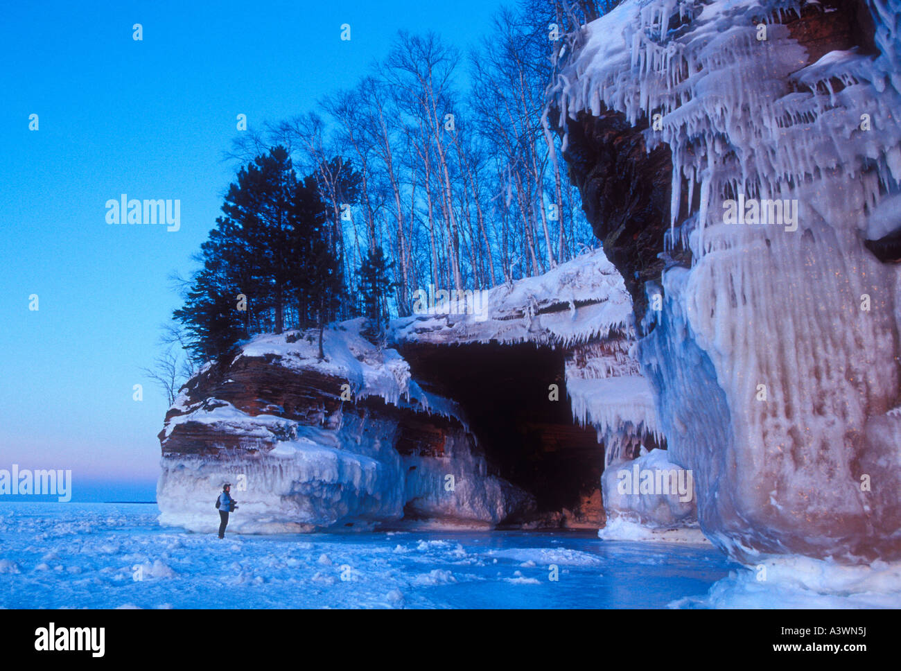 The ice covered sea caves of Lake Superior at Squaw Point in Apostle Islands National Lakeshore near Bayfield Wis Stock Photo