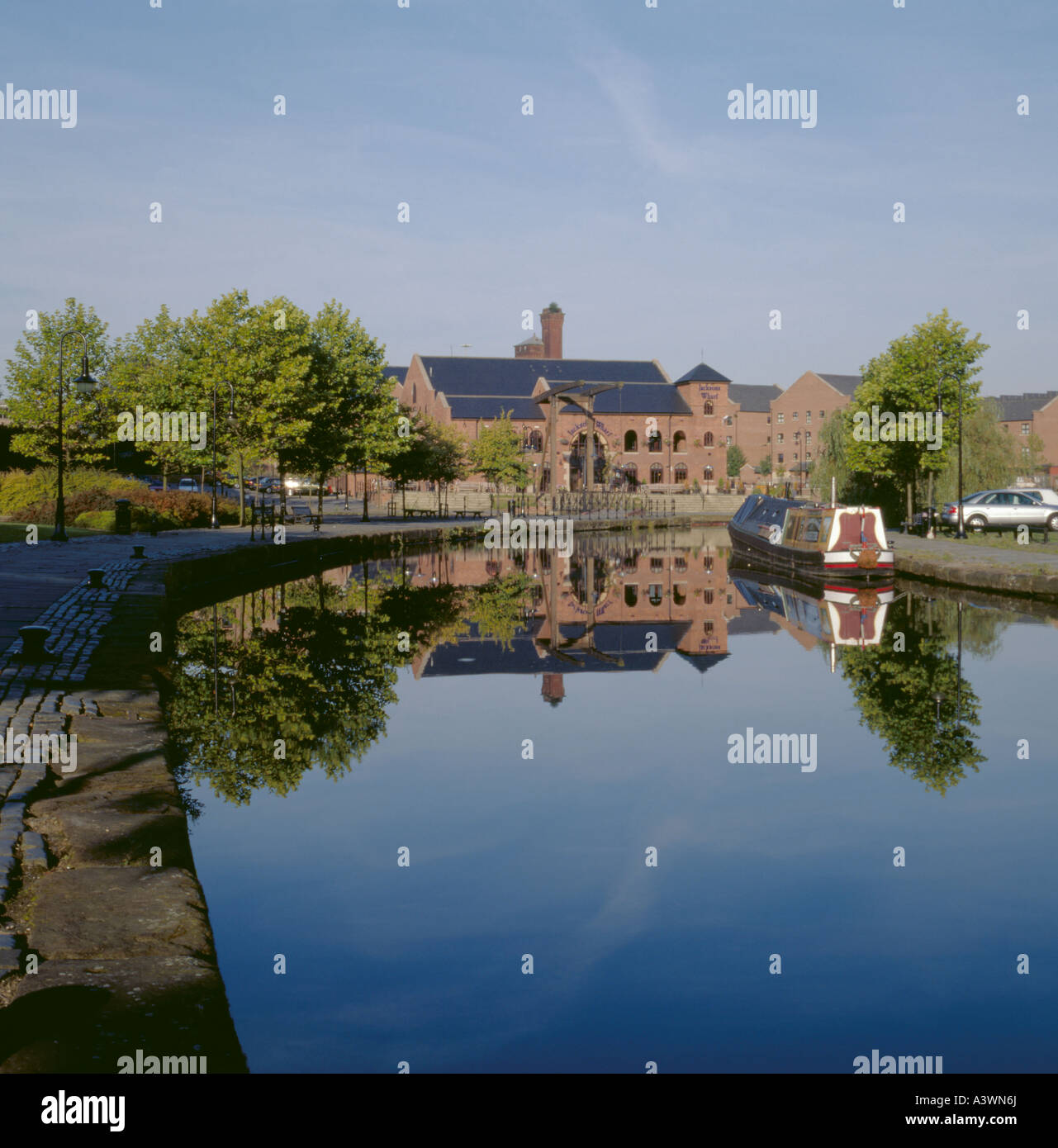 Merchants' Quay seen over Duke of Bridgewater's Canal, Castlefield Urban Heritage Park, near central Manchester, England, UK. Stock Photo