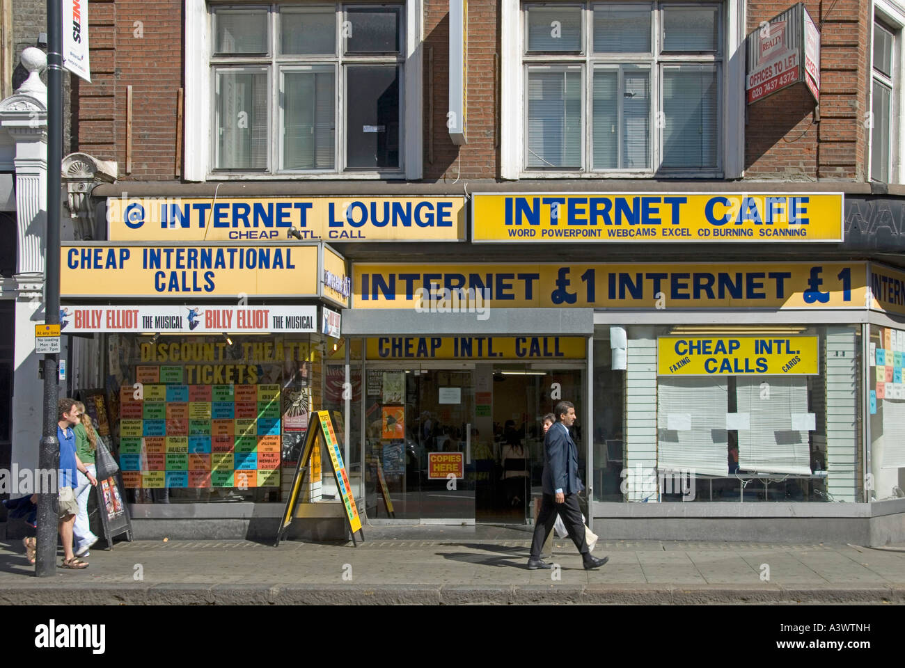 Shop premises operating Internet lounge cafe cheap international phone calls facilities & discount theatre ticket booking City of London England UK Stock Photo
