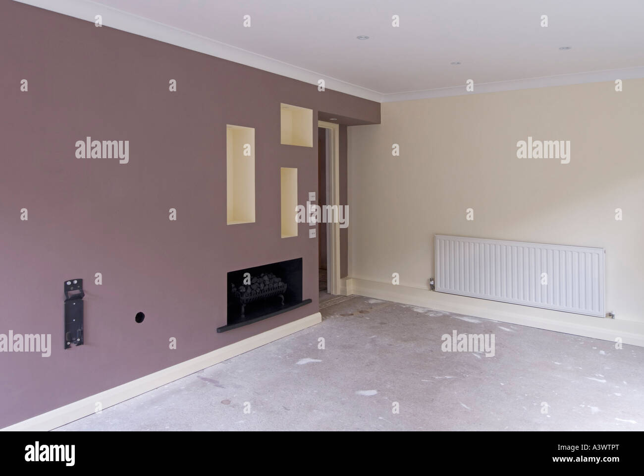 Home improvements interior makeover domestic lounge involving plaster & decorated emulsion paint recesses lighting England UK Stock Photo