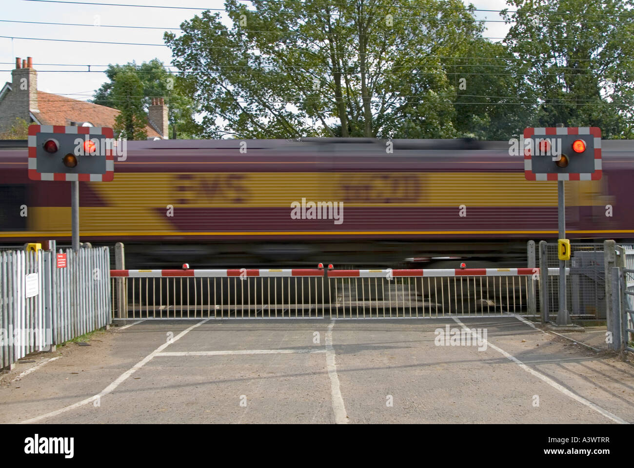 Railway Tracks Red Flashing Warning Light Sign Level Crossing Barrier Gates Country Road Ews Freight Train Motion Blur Margaretting Essex England Uk Stock Photo Alamy Railway Tracks Red Flashing Warning Light Sign Level Crossing Barrier Gates Country Road Ews Freight Train Motion Blur Margaretting Essex England Uk Stock Photo Alamy
