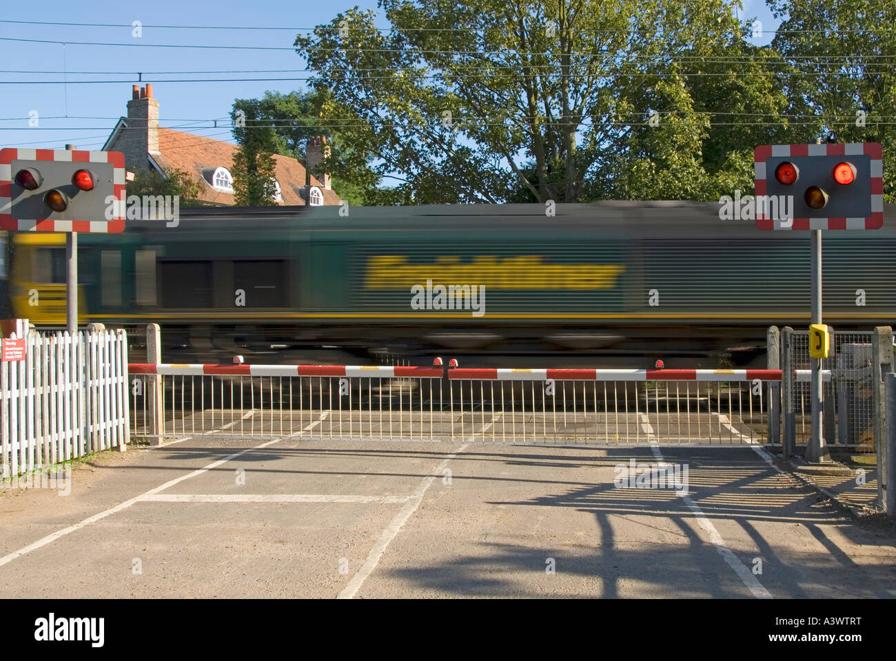 Railway Tracks Red Flashing Warning Light Sign Level Crossing Barrier Gates Country Road Freightliner Train Motion Blur Margaretting Essex England Uk Stock Photo Alamy Railway Tracks Red Flashing Warning Light Sign Level Crossing Barrier Gates Country Road Freightliner Train Motion Blur Margaretting Essex England Uk Stock Photo Alamy