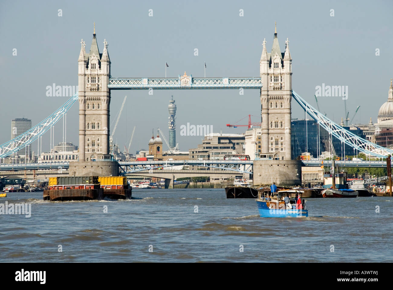 Tower Bridge framing the BT tower with boat traffic