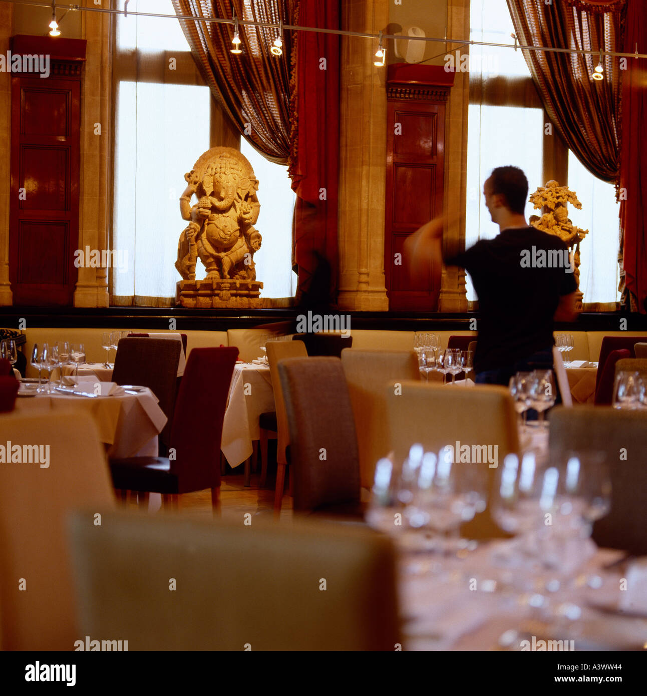 Inside Restaurant with table settings waiter Keywords Zaika Restaurant Kensington London glasses place settings location Stock Photo
