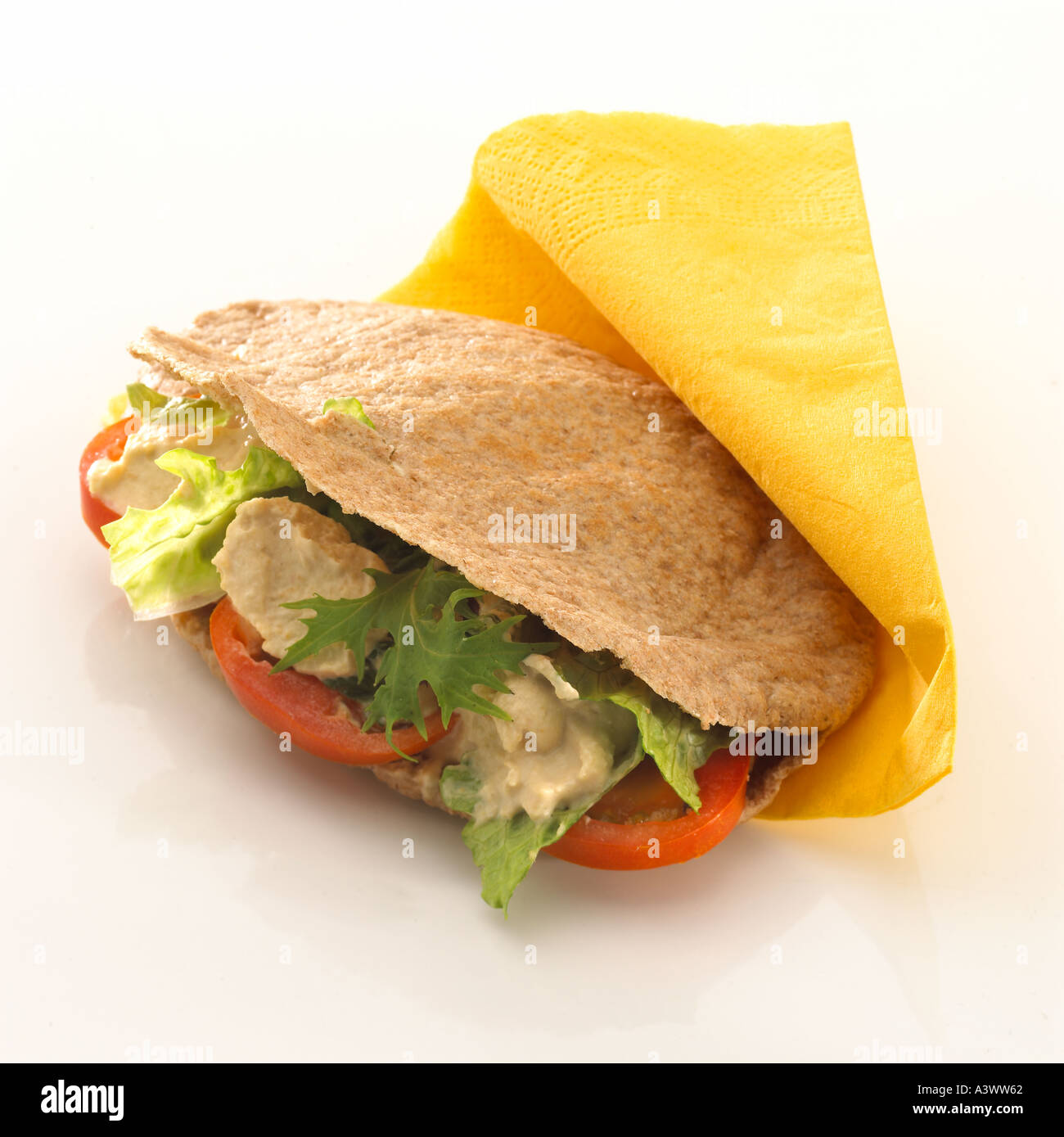 Wholemeal pitta with hummus lettuce tomato Keywords snack healthy bread