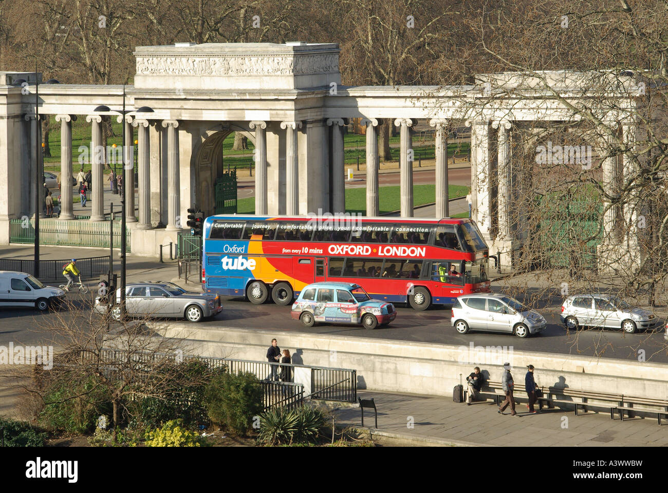 Oxford tube bus passing in front of the arch and columns of the Hyde
