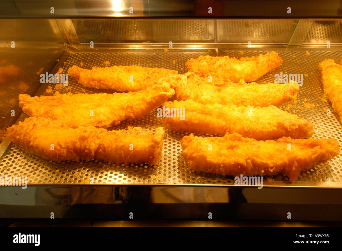 Cod fried in batter at fish and chip shop Stock Photo
