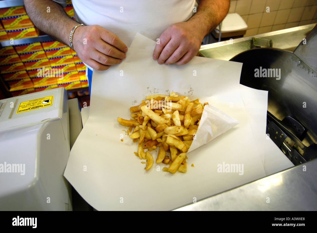 Portion of chips at fish and chip shop, England UK Stock Photo