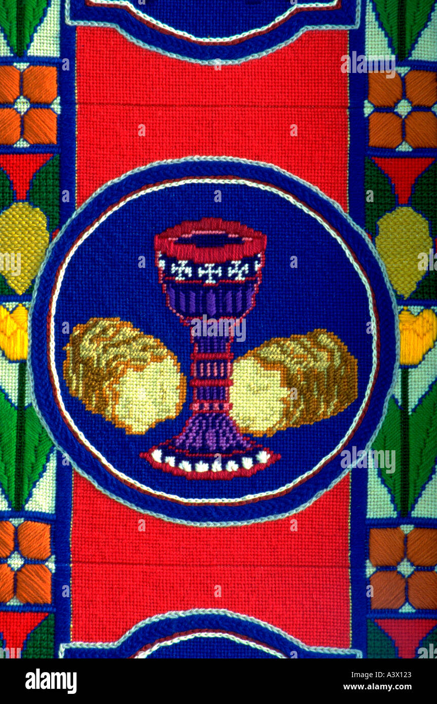 Communion bread and wine on needlepoint tapestry Olivet Church UCC. St
