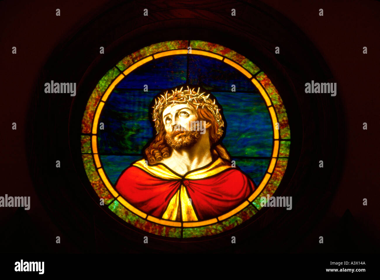 Jesus wearing crown of thorns on stained glass window. Minneapolis Minnesota USA Stock Photo