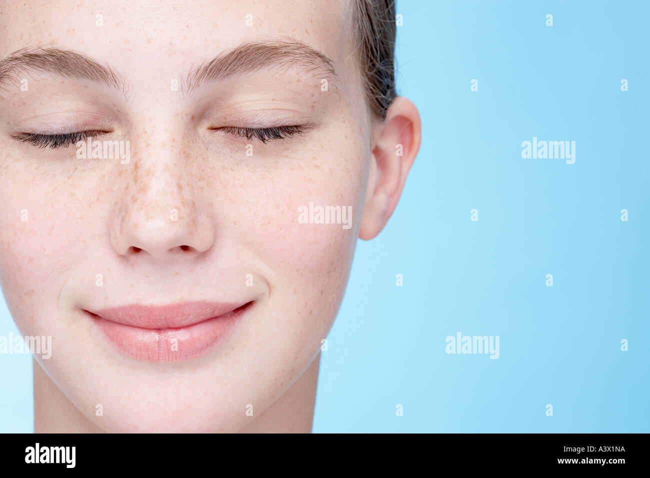 smiling young woman with closed eyes Stock Photo - Alamy