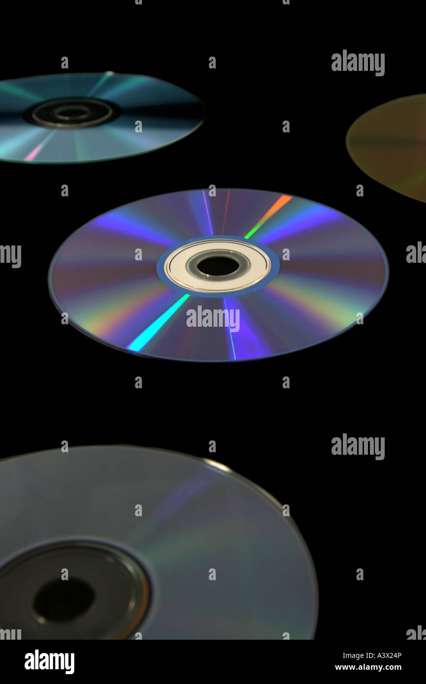 several cd s with prismatic light reflections isolated on black Stock ...