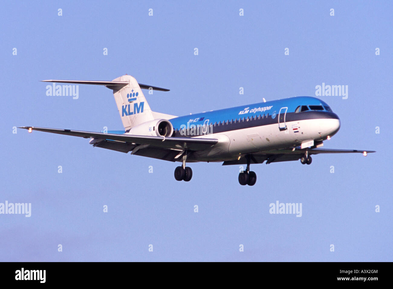 Fokker 70 operated by KLM Cityhopper approaching Birmingham Airport, UK Stock Photo