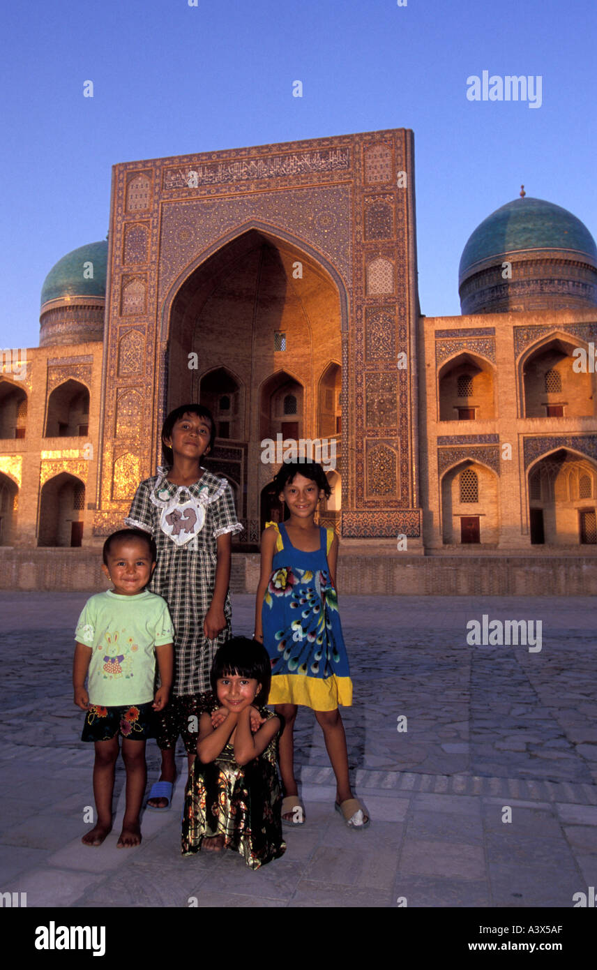 Young Uzbek children in front of Mir i Arab Madrasa, Bukhara ...