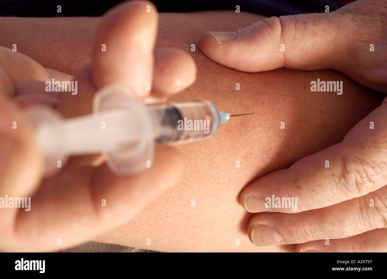 needle, an injection. photo by Bruce Miller Stock Photo - Alamy