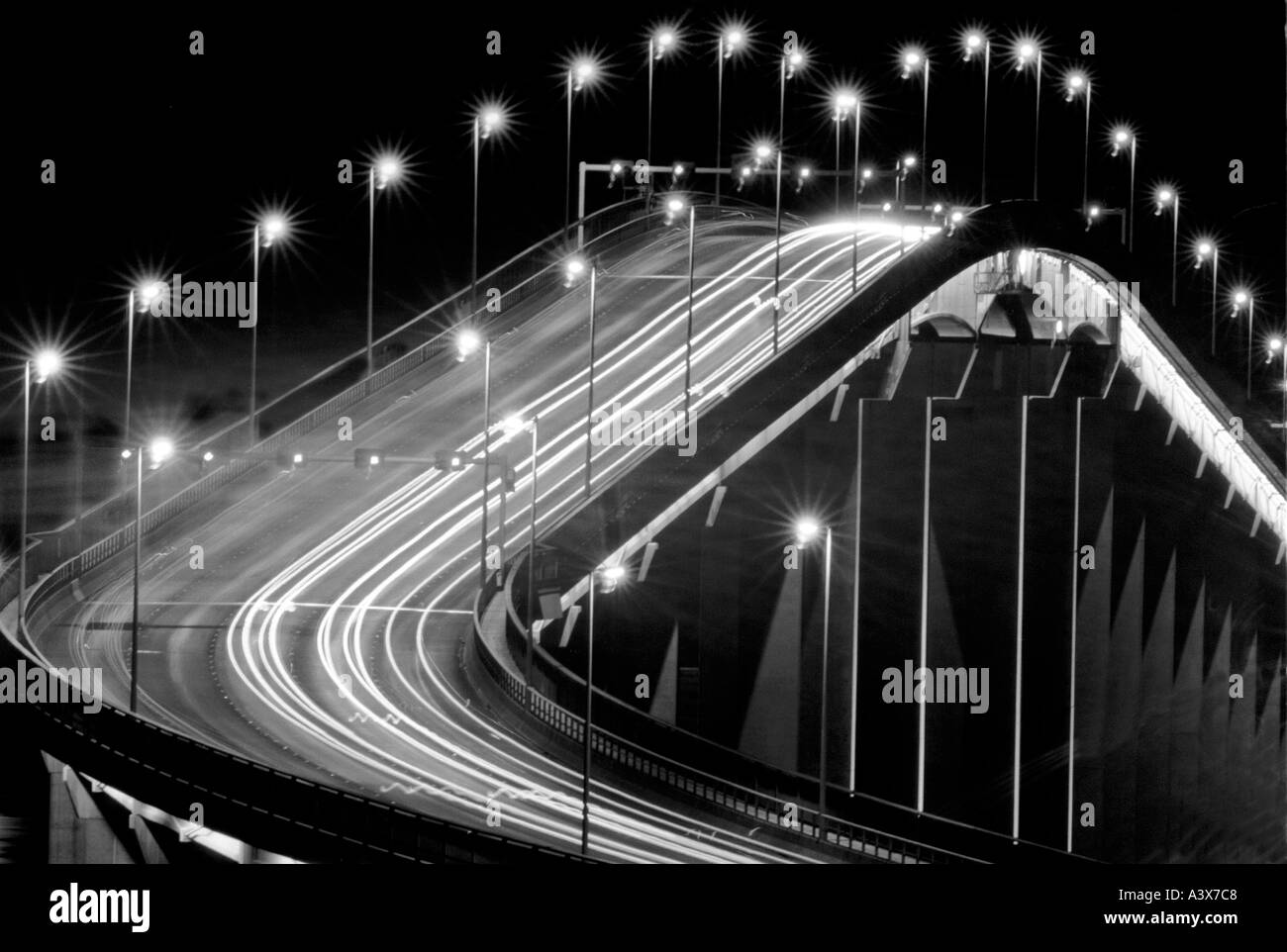 black and white photo of car lights over the  Derwent Bridge Hobart Tasmania Australia photo by Bruce Miller Stock Photo