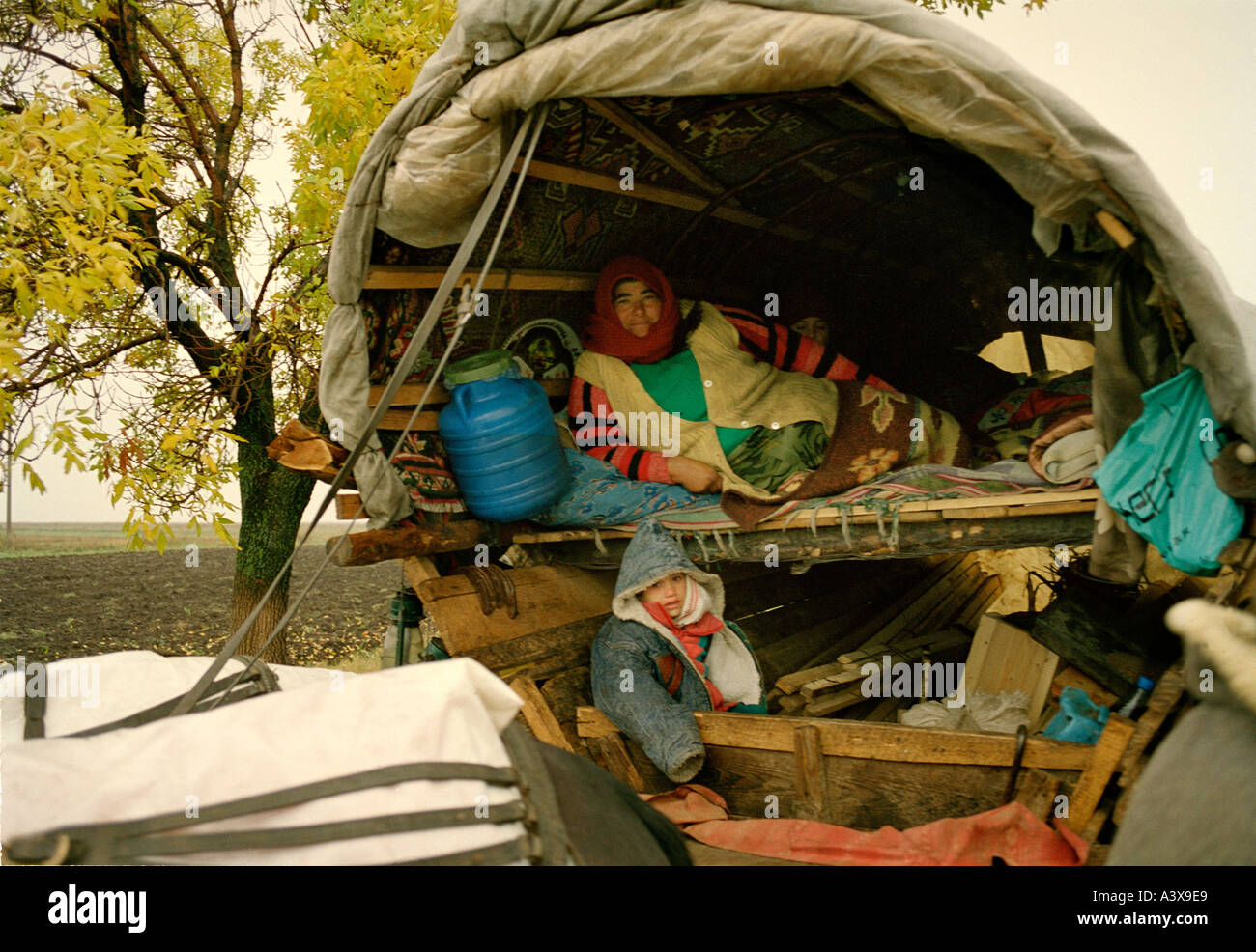 Family In A Traditional Gypsy Caravan Interior Romania