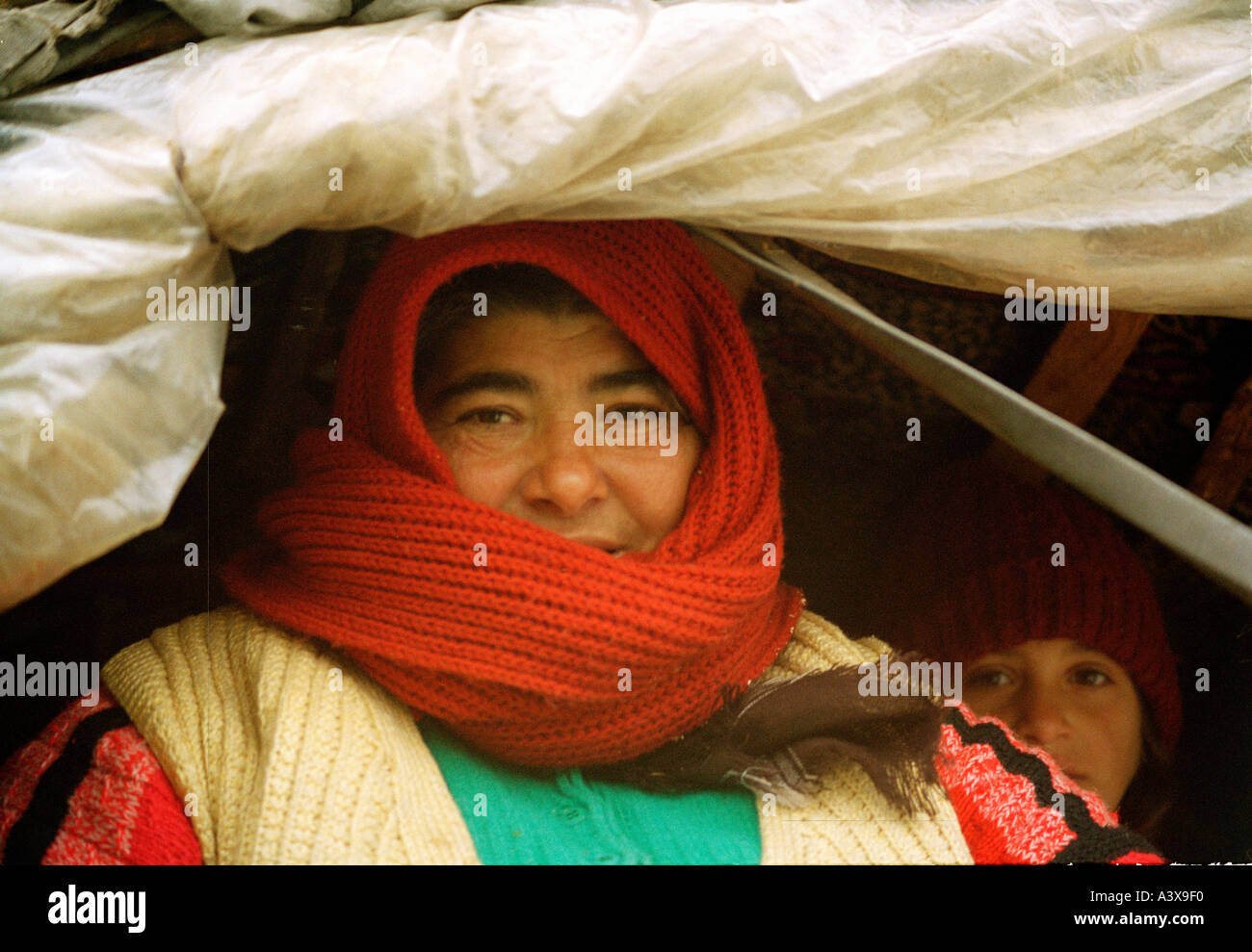 Older gypsy woman with her daughter in traditional gypsy wagon in Romania Stock Photo
