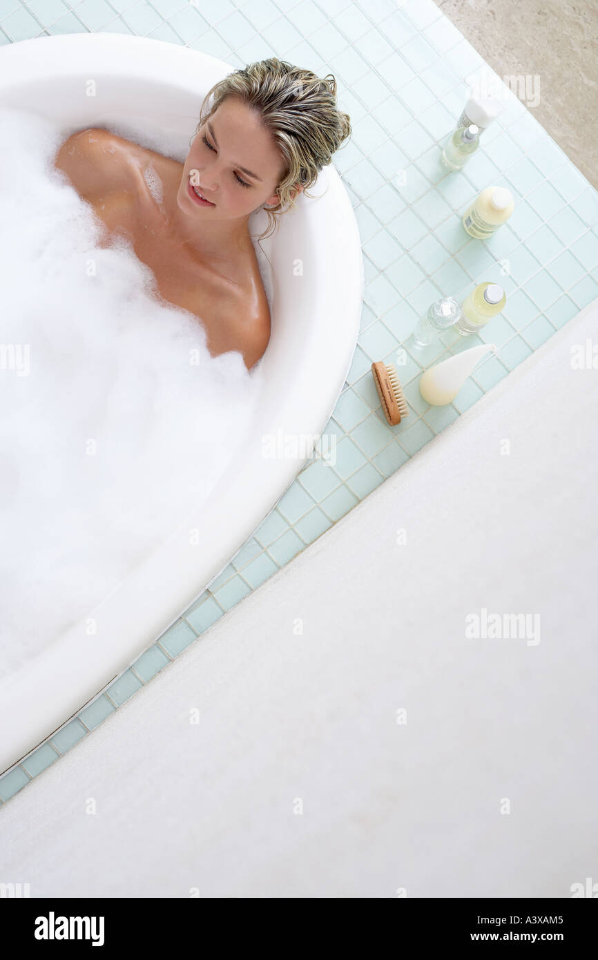 Young woman having a bubble bath in a bathtub Stock Photo Alamy