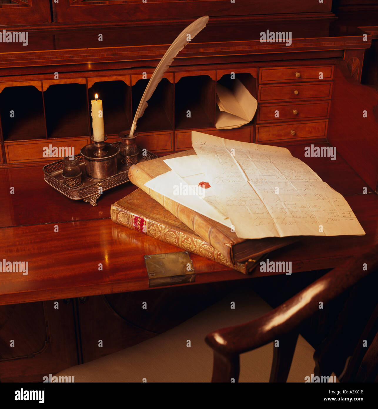 Antique desk with quill pen and papers. Stock Photo