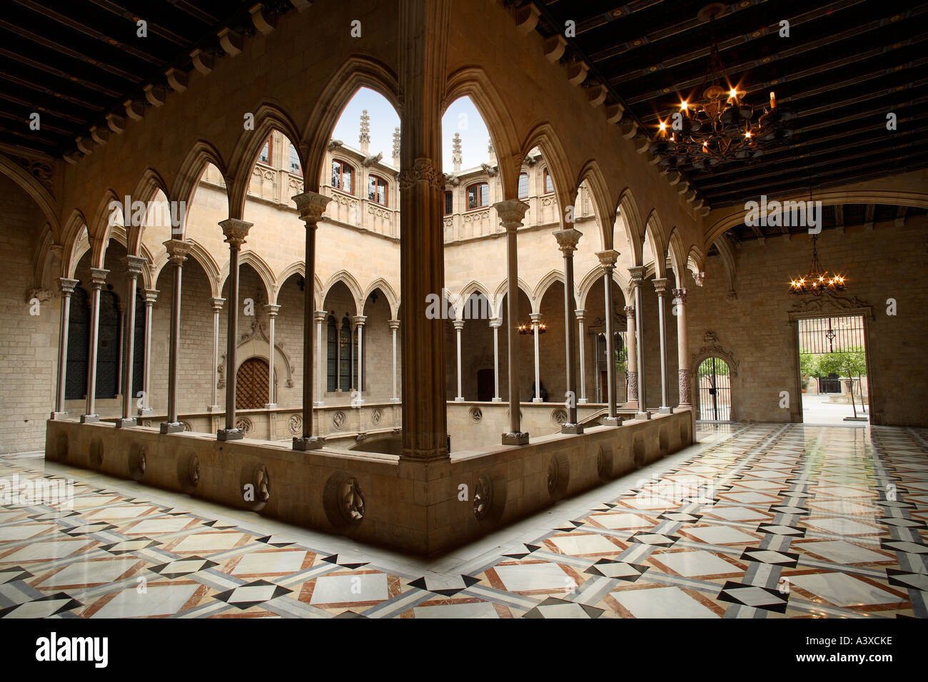 Inner courtyard, stairs, cloister and upper gallery, complex designed by Marc Safont, sculptures by Pere Joan in 15th century. Stock Photo
