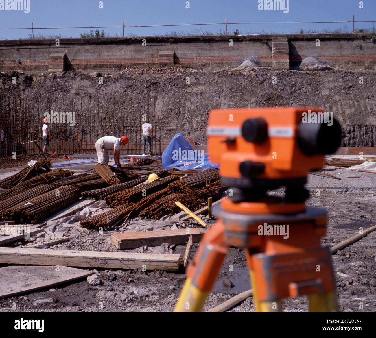 Steel fixers positioning mild steel reinforcing bars on a construction site, Northumberland