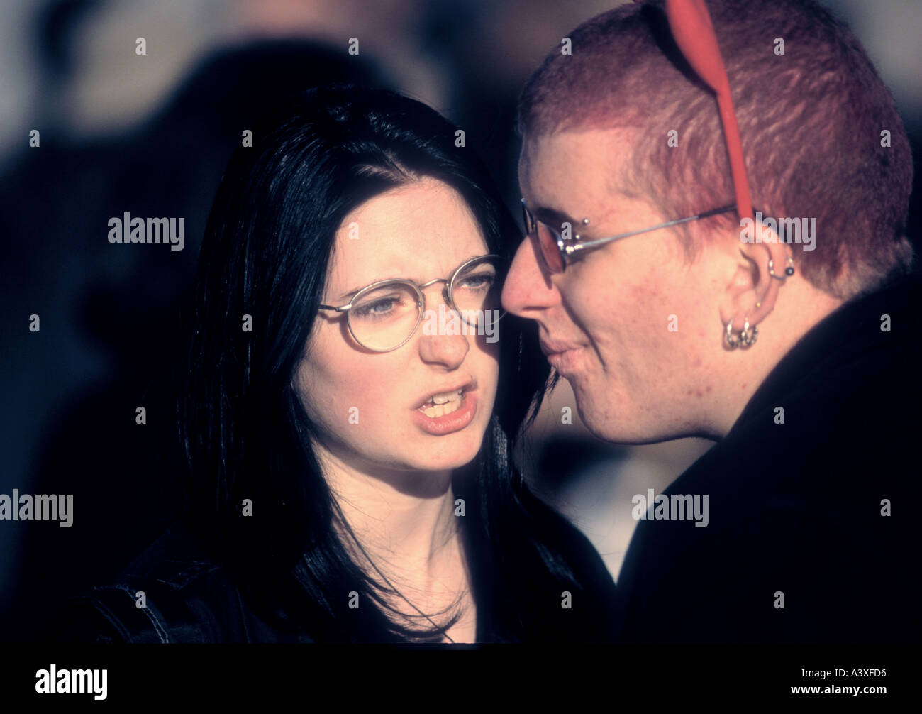 Punk Goth couple talking in an unhappy way, she being mad Stock Photo