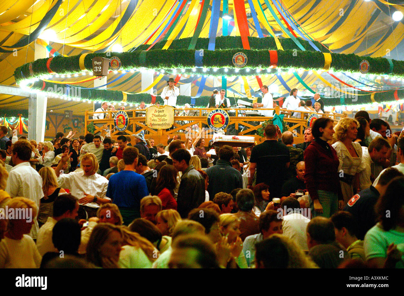 happy people in beer tent Oktoberfest in Munich Stock Photo