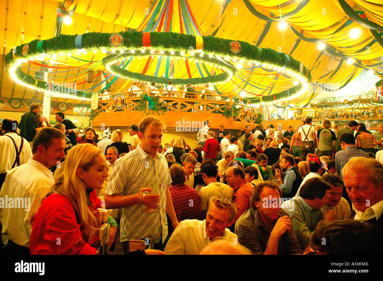 happy people in beer tent Oktoberfest in Munich Stock Photo