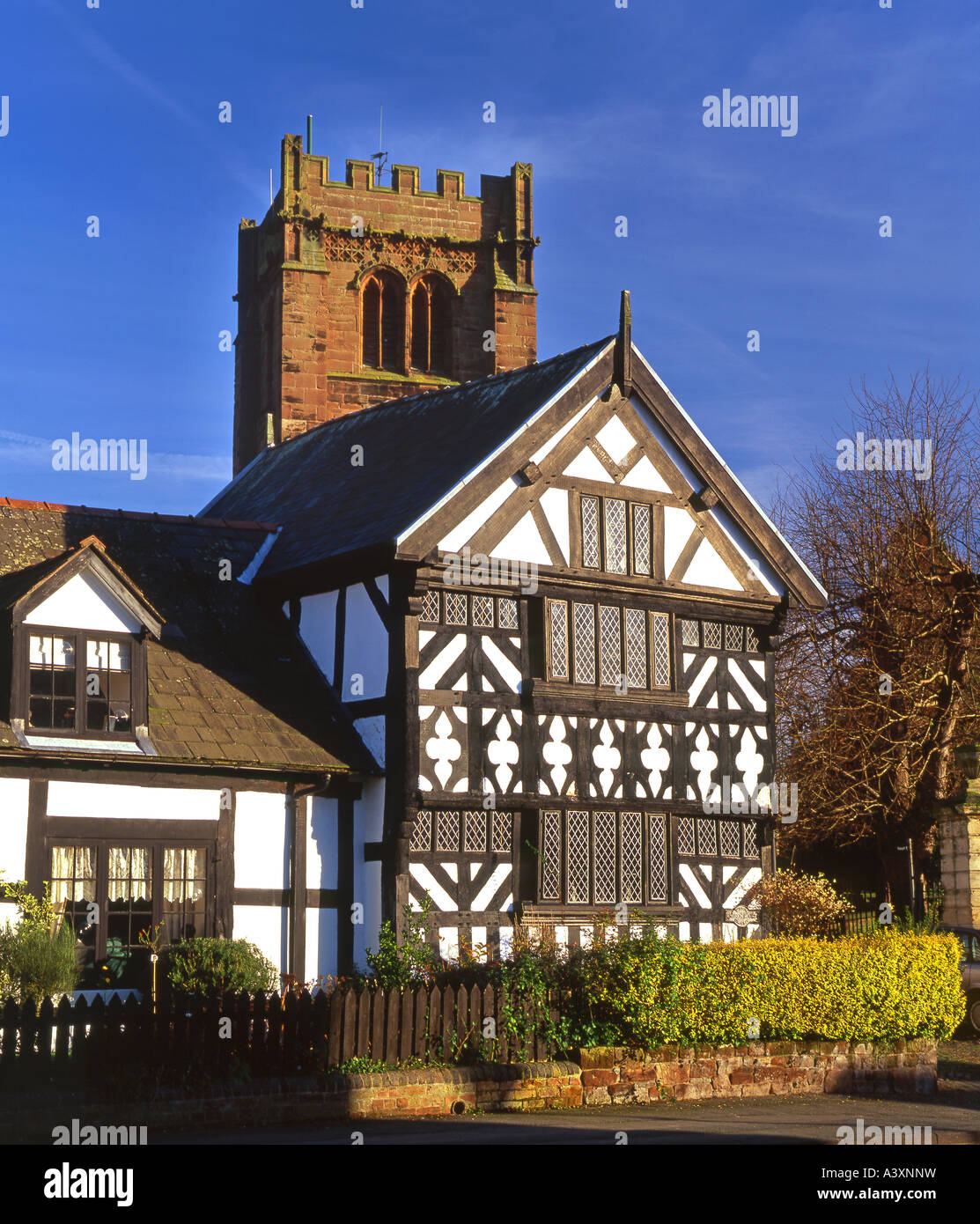 The Church House and St Andrews Church Tower, Church Street, Tarvin, Cheshire, England, UK Stock Photo